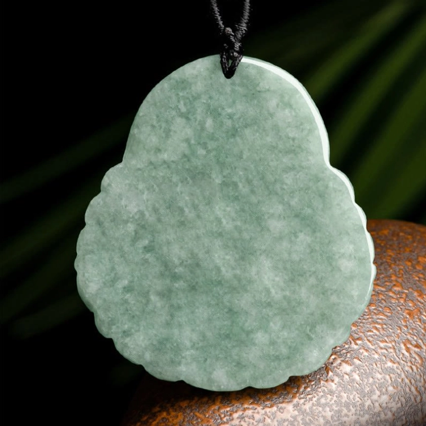 Back view of Laughing Buddha jade pendant showing smooth uncarved surface and rope attachment
