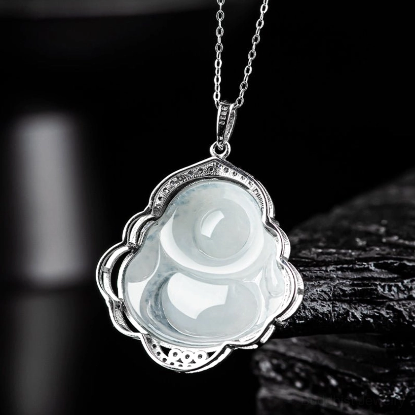 Back view of Laughing Buddha jade pendant with flower-shaped silver metal frame and polished natural stone surface