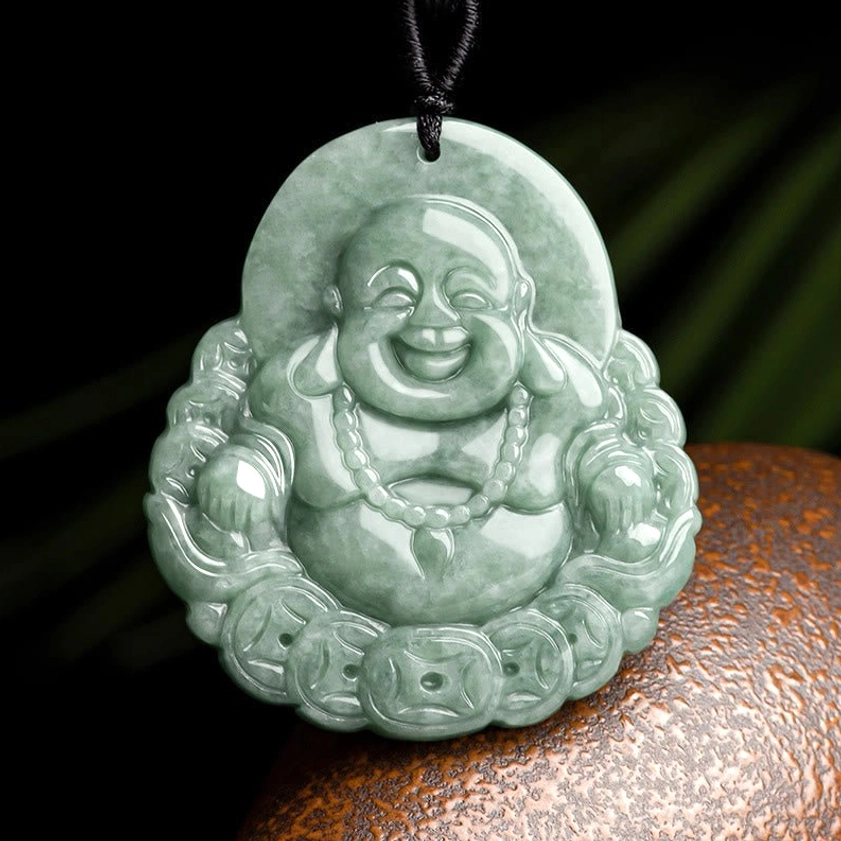 Laughing Buddha jade pendant with copper coin border, front top view showing intricate carving and light green jadeite