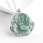 Laughing Buddha jade pendant necklace with titanium steel CZ frame, translucent green jade carving on white background