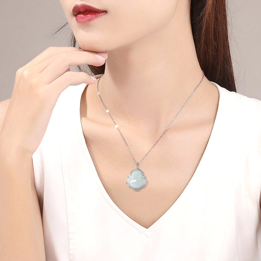 Laughing Buddha jade stone pendant angled side profile showing exposed silver claw setting and carved Buddha detail