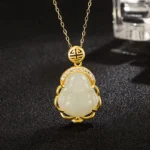Laughing Buddha white jade pendant necklace with 925 sterling silver chain, top-down close-up view showing polished jade carving and gold-tone setting