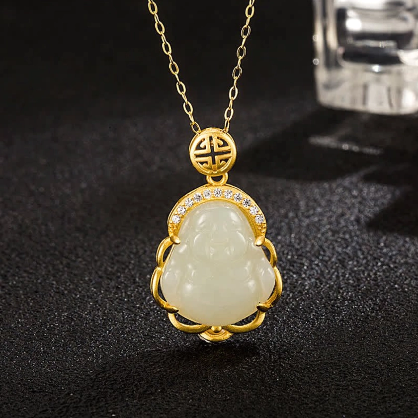 Laughing Buddha white jade pendant necklace with 925 sterling silver chain, top-down close-up view showing polished jade carving and gold-tone setting