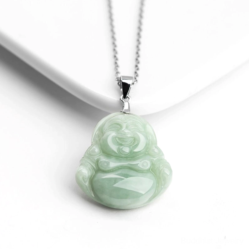 Maitreya Buddha jade pendant necklace front overhead flat lay with round smiling Buddha carving light green jade and silver hanging clasp on white background