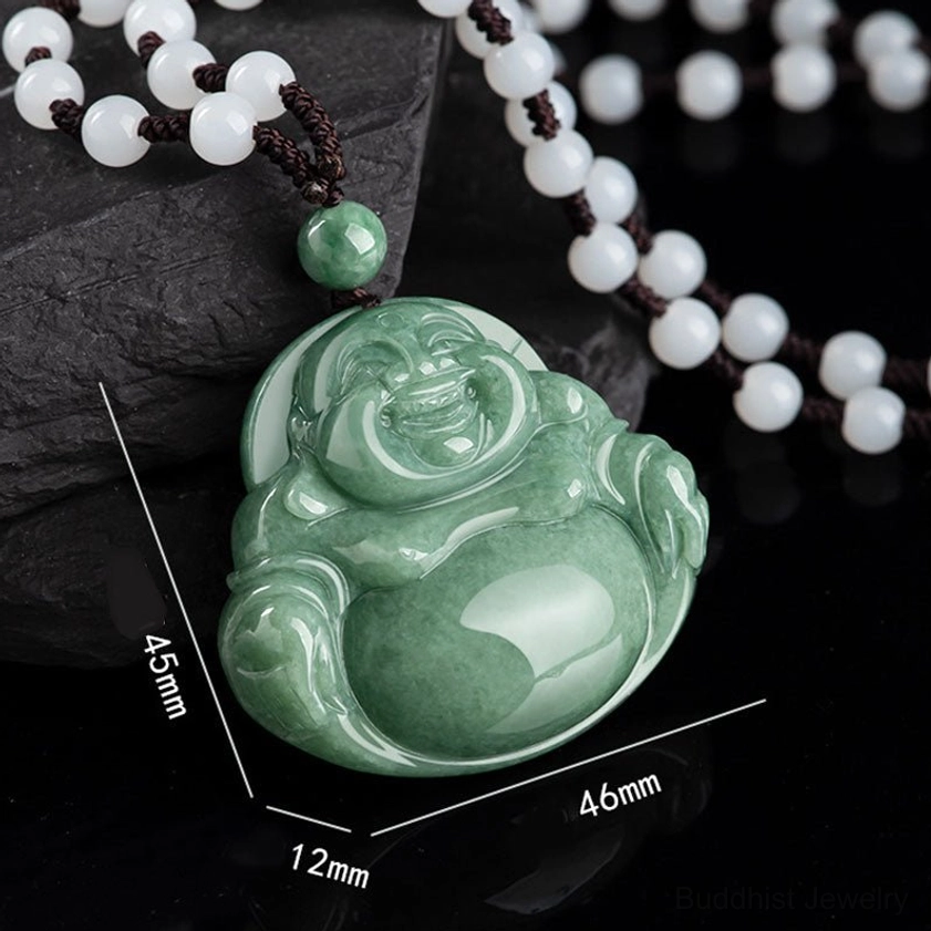 Cyan jade Buddhist pendant with size measurement markings showing dimensions on slate background