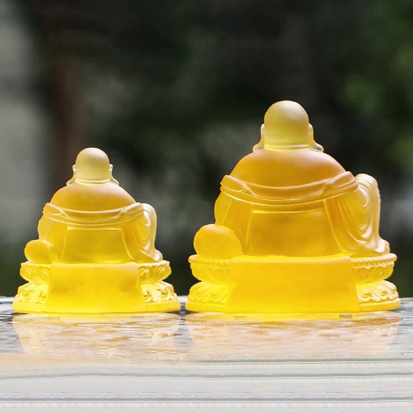 Rear view of Laughing Buddha Liuli crystal statues showing carved robe details and lotus pedestal design
