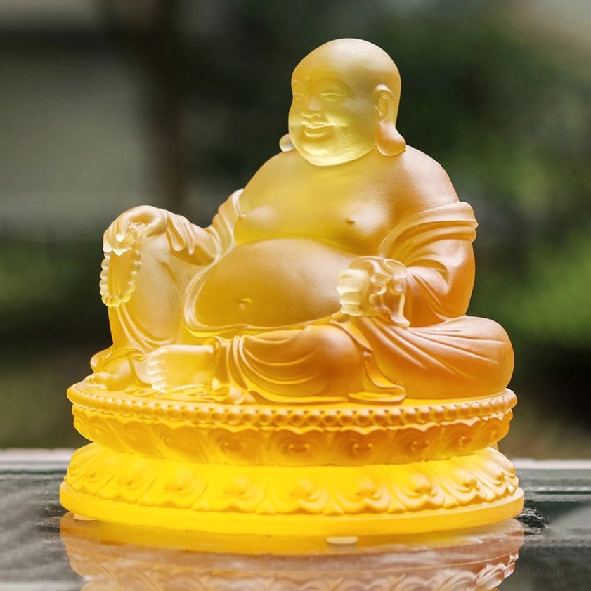 Laughing Buddha Liuli crystal statue three-quarter side view outdoor setting holding prayer beads detailed lotus pedestal