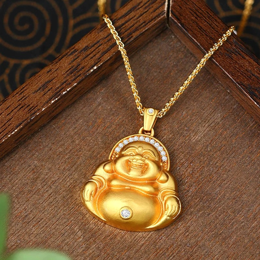 Laughing Buddha Buddhist pendant displayed on wooden tray showing Maitreya design with diamond-like zircon accents