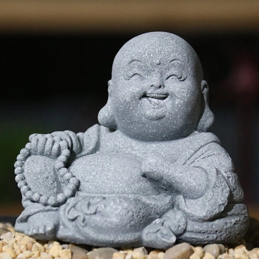 Laughing Buddha Maitreya monk figurine holding prayer beads, grey stone texture, symbol of happiness and abundance for home decoration