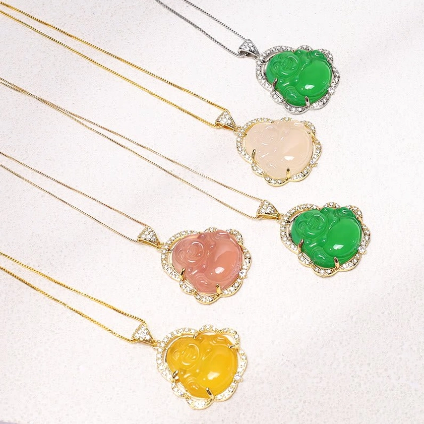 Collection of multicolor laughing Buddha jade necklaces in gold and silver, flat lay display showing style variety