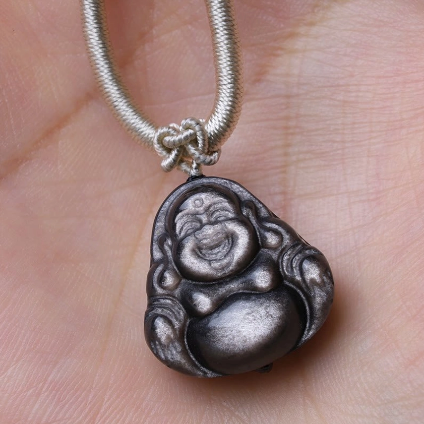Maitreya Buddha obsidian pendant necklace on palm, light grey braided rope with smooth carved Buddhist pendant