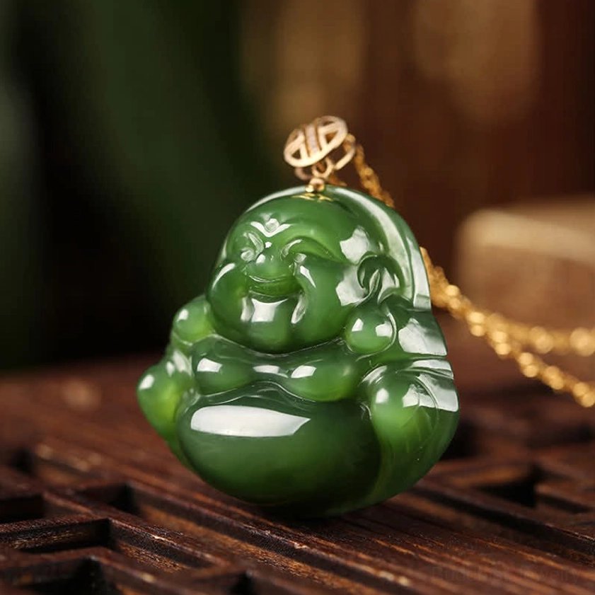 Side view of laughing Buddha jade necklace with sterling silver chain and gold longevity clasp