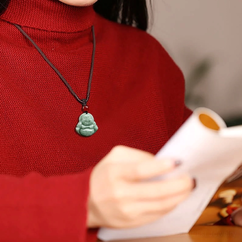 Green jade Laughing Buddha Buddhist necklace being worn for everyday spiritual practice and daily wear