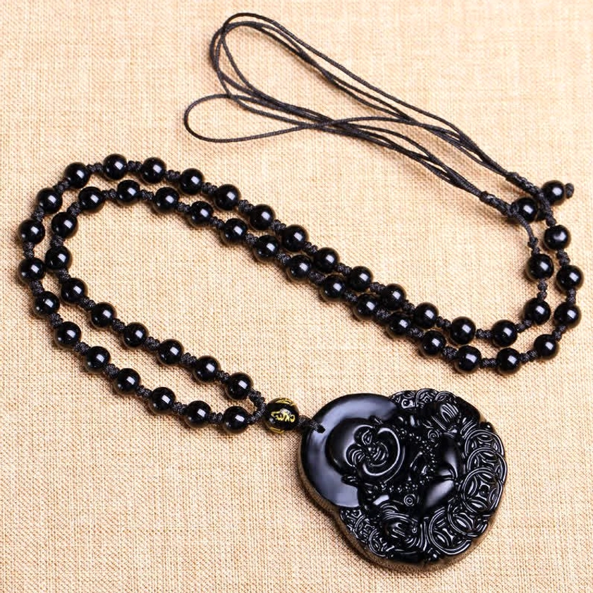 Complete black obsidian laughing Buddha pendant necklace with woven beaded chain - flat lay full necklace view