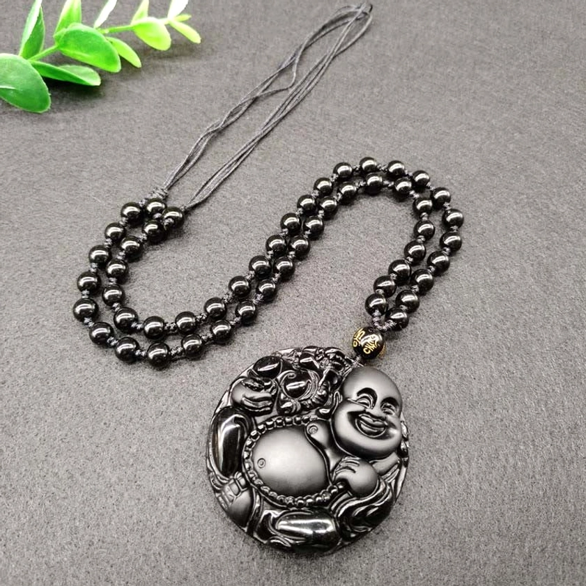 Full Black Obsidian Buddhist necklace with adjustable beaded chain and decorative spacer bead, flat lay product view