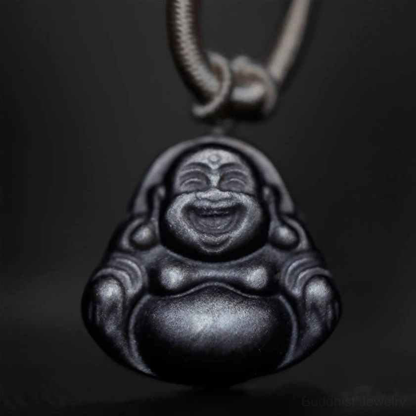 Laughing Buddha obsidian pendant on palm, light grey braided cord with gold accent beads and decorative knot detail