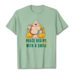 Mint green Laughing Buddha Peace Begins With A Smile graphic t-shirt front flat lay view
