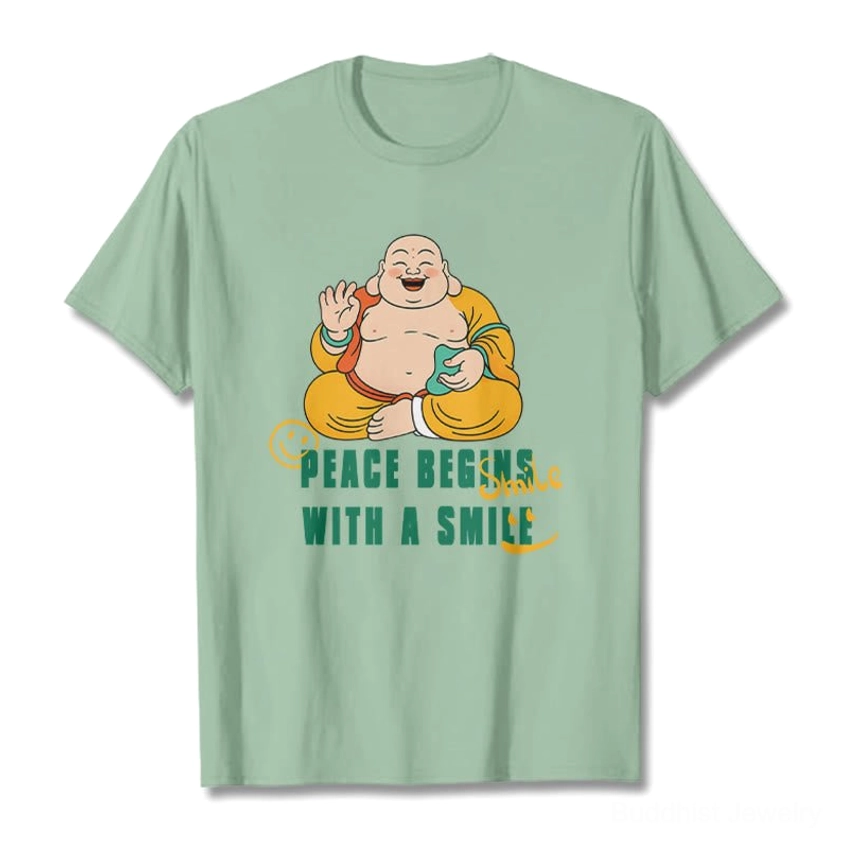 Mint green Laughing Buddha Peace Begins With A Smile graphic t-shirt front flat lay view