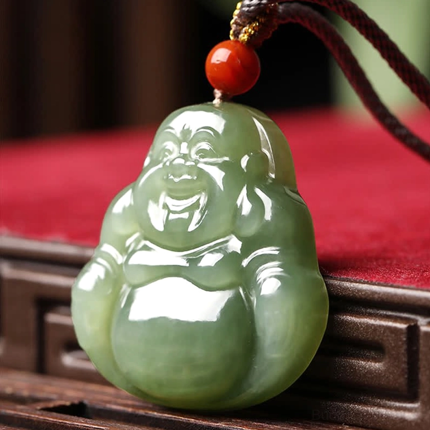 Laughing Buddha jade pendant necklace front display with dark brown cord and red accent bead on red flannel