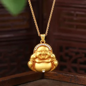 Laughing Buddha gold pendant necklace front view with zircon inlays and Fu character carving on traditional wooden background