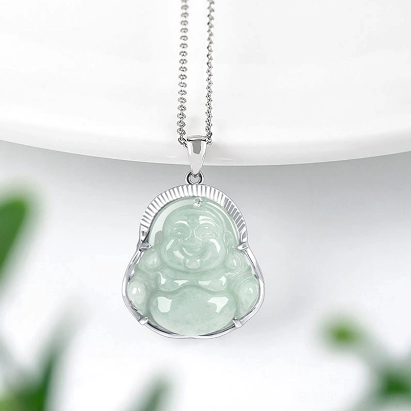 Buddhist jade pendant side angle showing detailed craftsmanship of laughing Buddha carving with silver chain and bezel setting