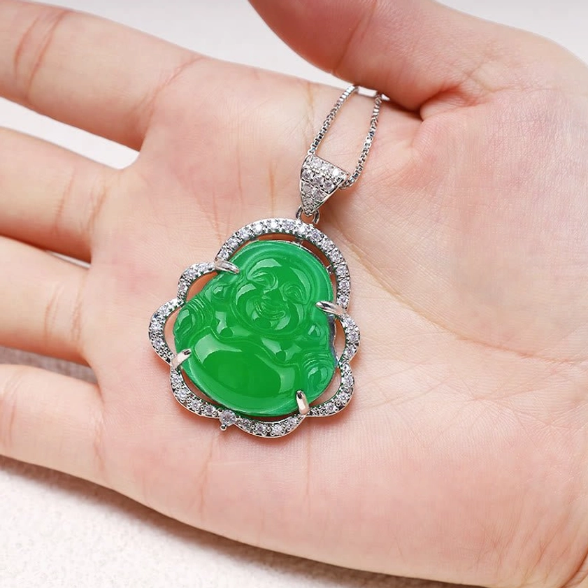 Laughing Buddha silver jade pendant necklace held in palm, portable spiritual jewelry size reference