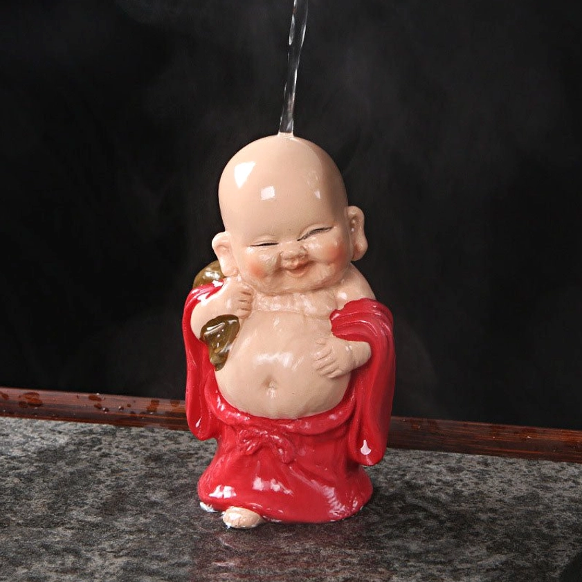 Laughing Buddha tea pet showing natural patina development over time with repeated tea pouring and cultivation