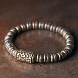 Lava rock copper bracelet top view showing hand-hammered copper accents and natural volcanic stone beads