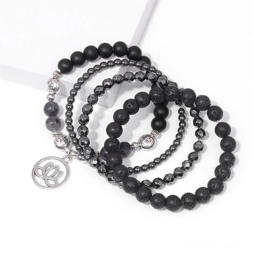 Multiple layered lava stone lotus bracelets stacked together showing elastic design and lotus pendant