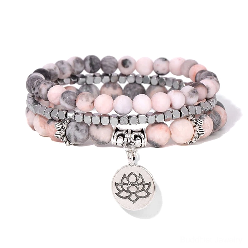 Multi-strand layered lotus charm beaded bracelet flat lay front view white background