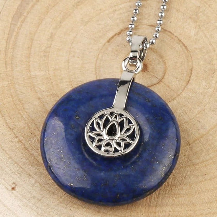 Lazurite lotus donut pendant necklace - close-up view of blue gemstone charm