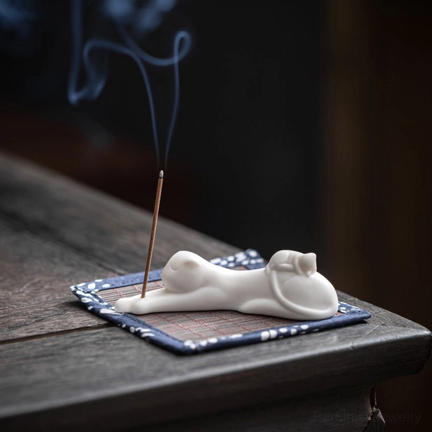 Lazy cat ceramic incense holder resting pose, unique design with gold accent, perfect decorative incense burner for home and meditation space