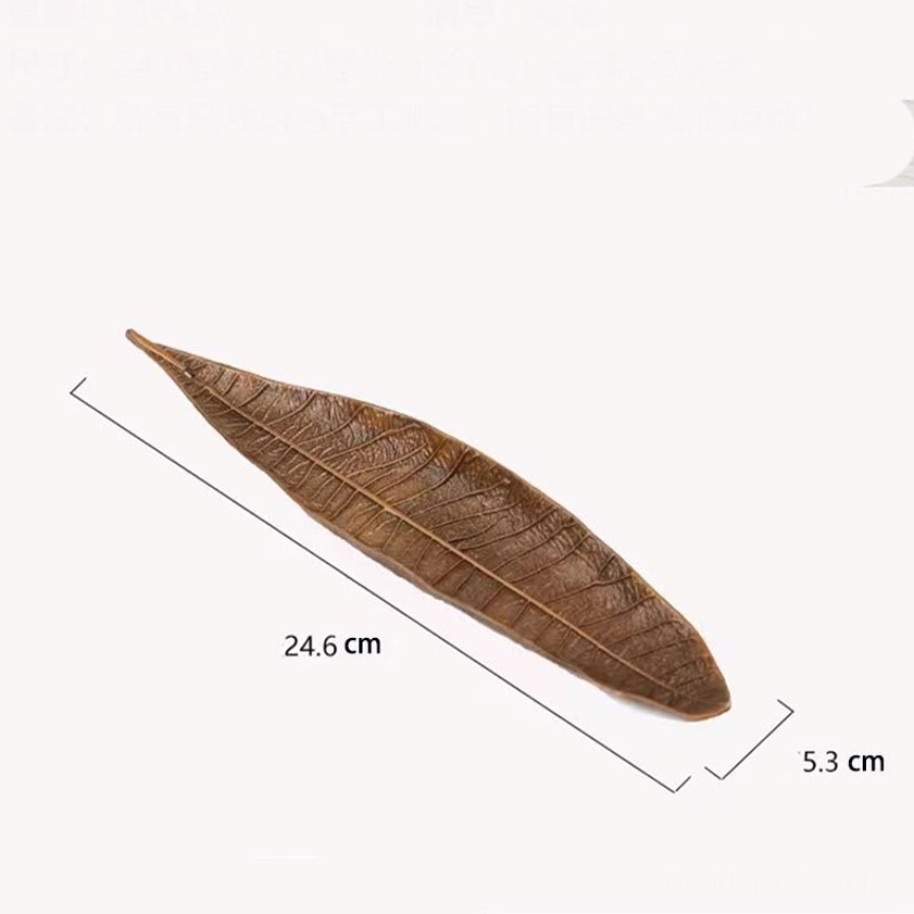Buddhist leaf-shaped incense burner in meditation room spiritual altar setting with candles