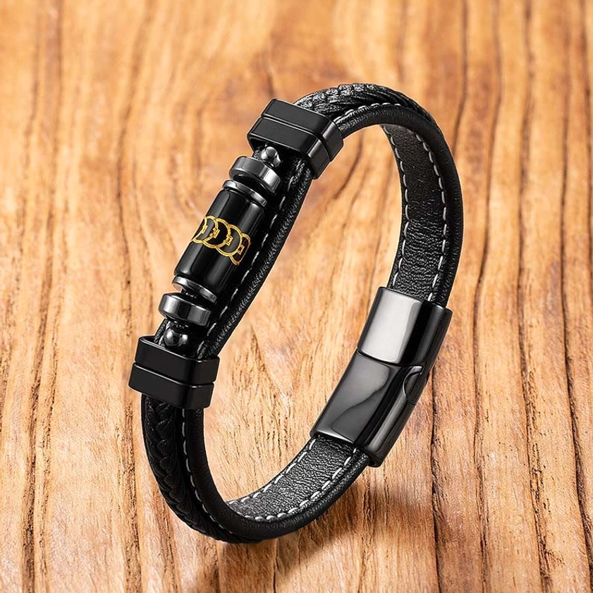 Black leather beaded Buddhist bracelet with dual metal decorative beads and secure titanium steel buckle, overhead shot