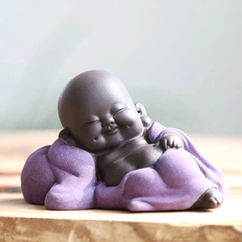 Leisurely purple laughing Buddha statue displaying contentment and joy, handmade clay decor for mindful living