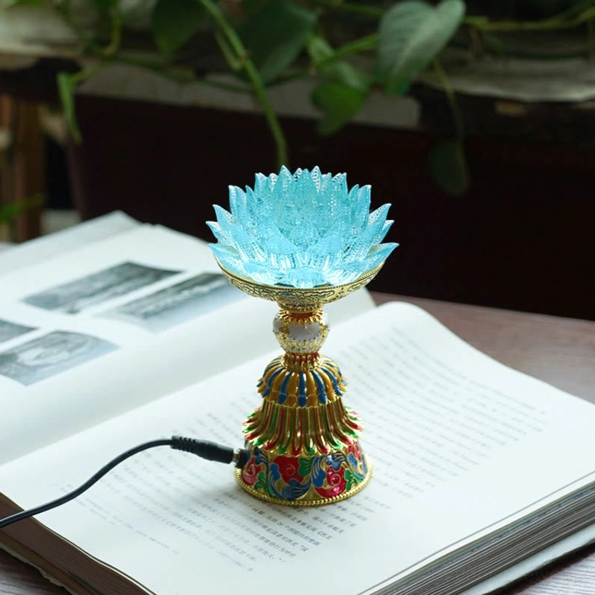 Light blue liuli glass lotus lamp with soft petals and auspicious symbols enamel base