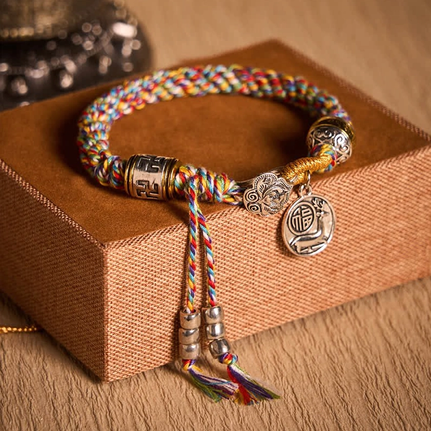 Light Colorful Woven Buddhist Bracelet with Sacred Symbols and Silver Charms