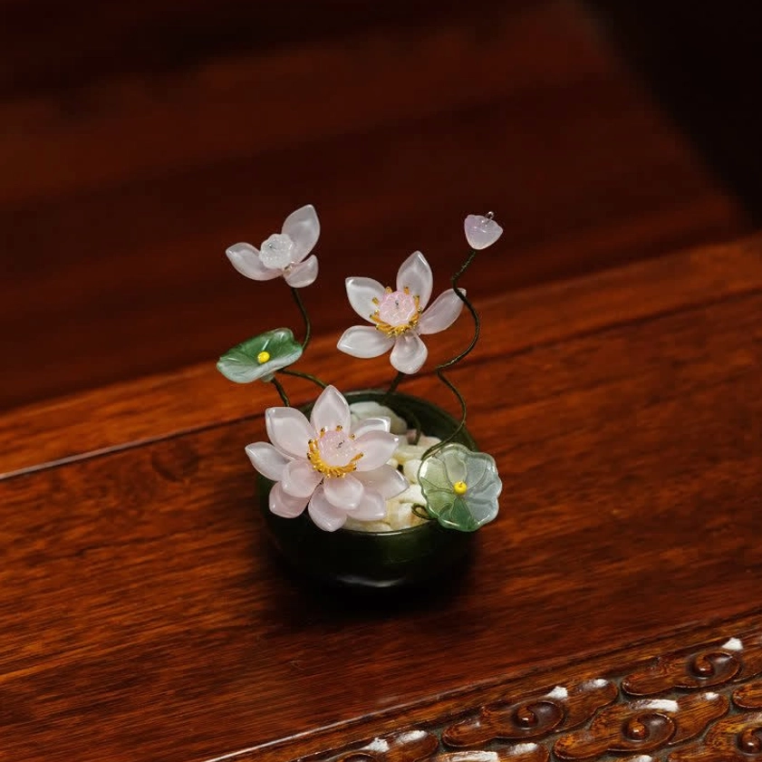 Light pink liuli glass lotus flower pot with buds metal stems ceramic base side view