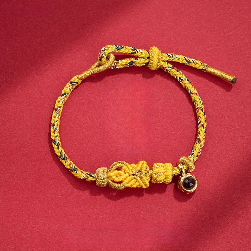 Light Yellow Buddhist string bracelet with hand-woven Buddha knot showing artisan craftsmanship