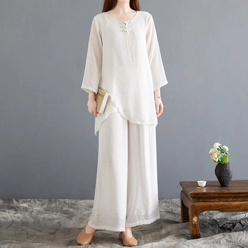 Women wearing linen meditation two-piece set with traditional frog buttons on neckline - demonstrates relaxed fit for Zen meditation and mindfulness practice