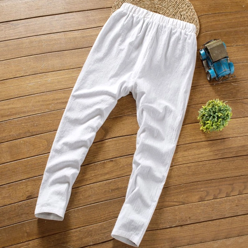 Straight leg linen pants drawstring elastic waist oblique flat lay view detail