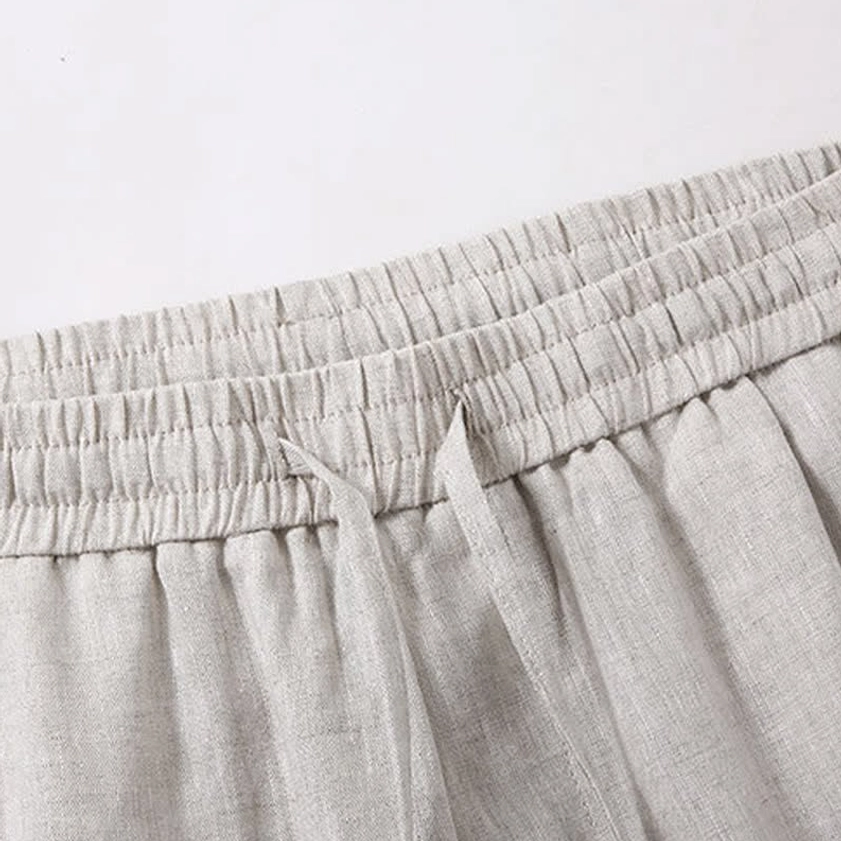 Close-up detail of elastic waistband and drawstring on linen meditation shorts - breathable natural fibers for comfortable sitting