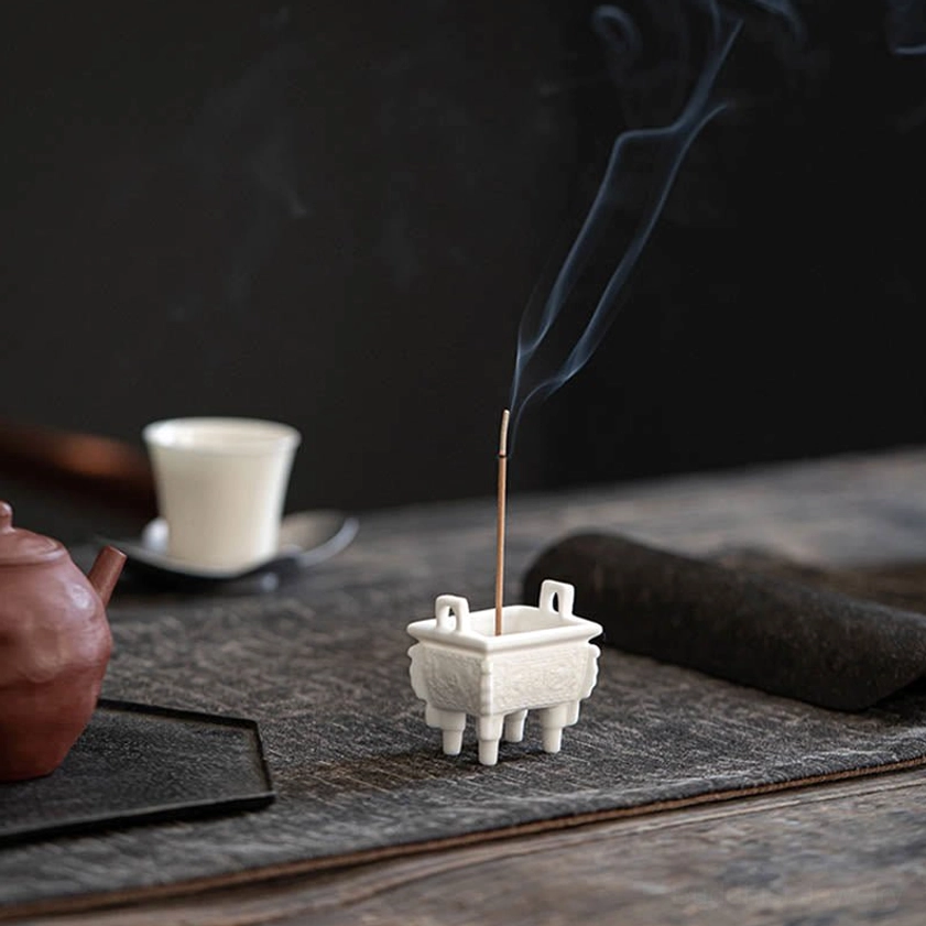 White ceramic incense burner with lion ear design, hand-carved details emphasizing strength and spiritual protection