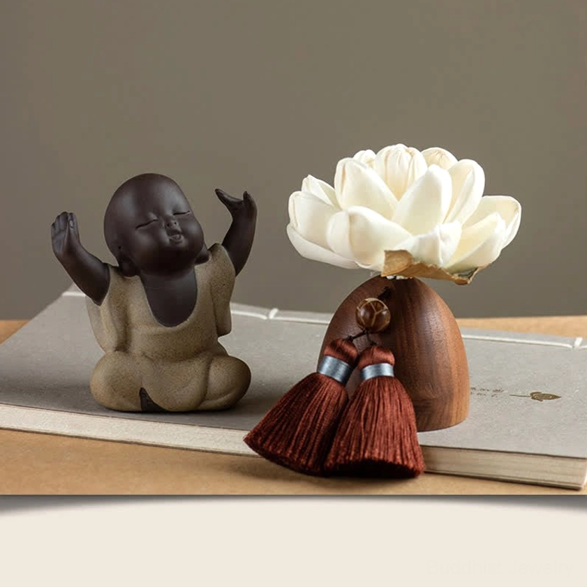 Little Maitreya Buddha figurine carved from black peach wood, joyful expression meditation decor
