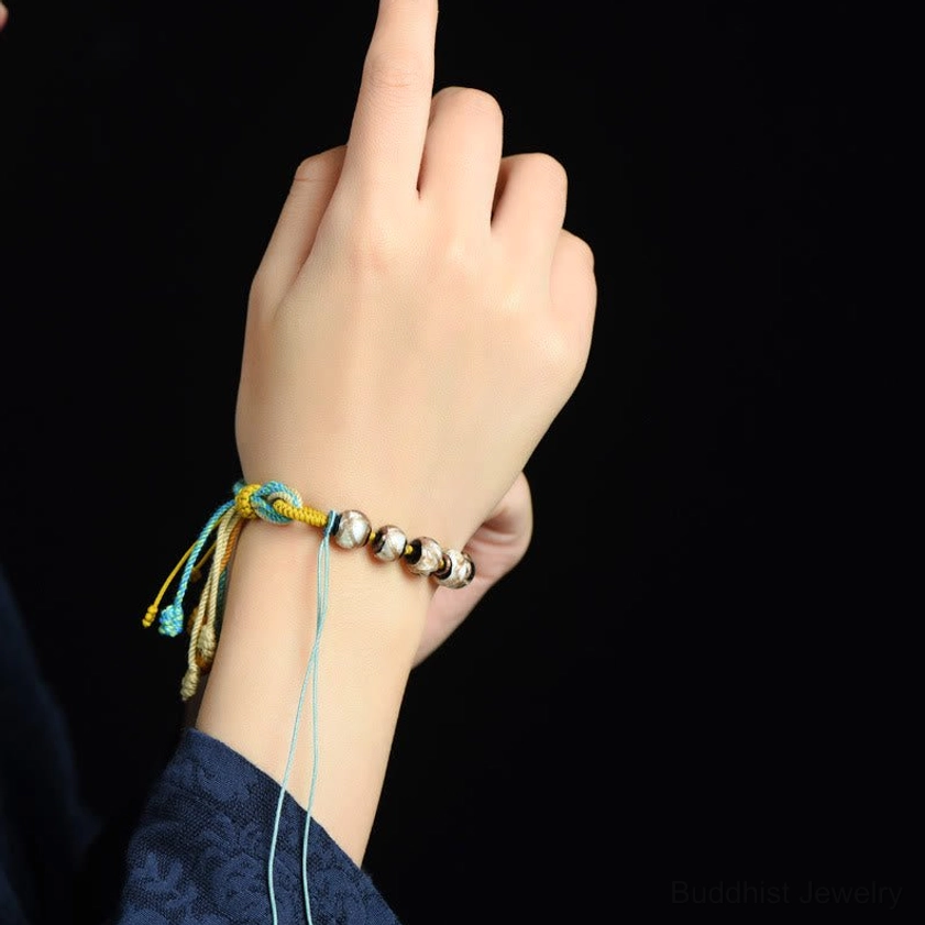 Wearing demonstration of multicolored Liuli glass bead bracelet on wrist showing fit and comfort
