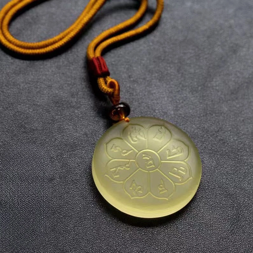 Eight-petal Liuli crystal wealth god mantra pendant necklace in light yellow translucent material with engraved Sanskrit mantras