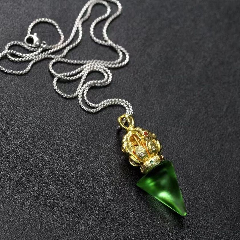 Handmade Liuli crystal Dorje pendant - showing authentic pâte de verre craftsmanship and color variation