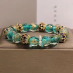 Teal Liuli glass cloisonné Buddhist bracelet with gold leaf enamel beads and white pearl spacers in jewelry box