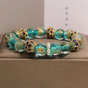 Teal Liuli glass cloisonné Buddhist bracelet with gold leaf enamel beads and white pearl spacers in jewelry box