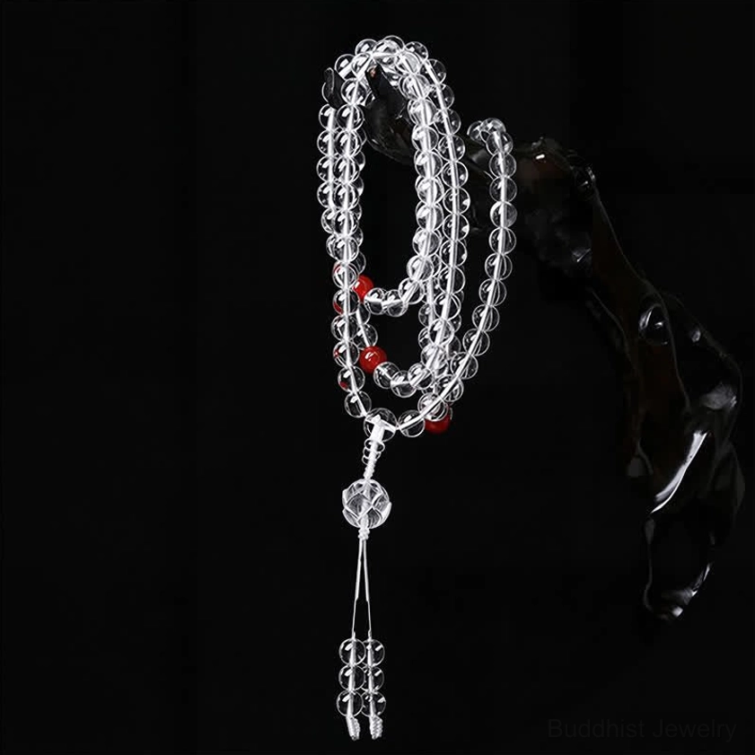 Liuli lotus 108 meditation mala with red beads and crystal tassel, vertical hanging display on wooden stand